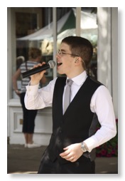 Tom Wyllie singing in Morpeth Market Place